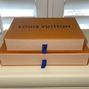 Two Louis Vuitton empty boxes.